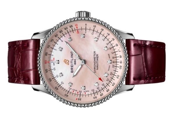 The stainless steel fake watch has a wine red strap.