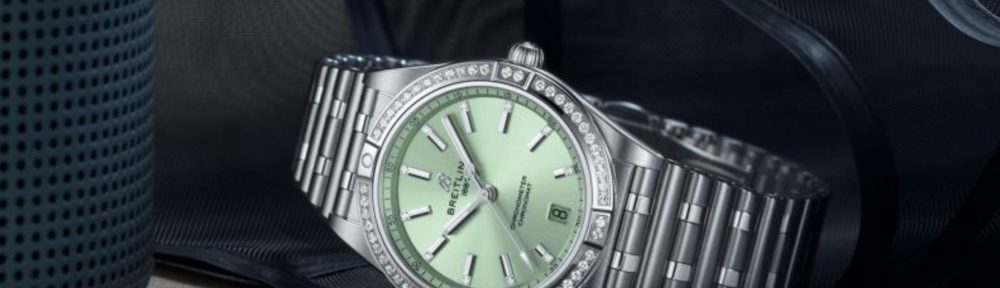 The mint green dial fake watch is decorated with diamonds.