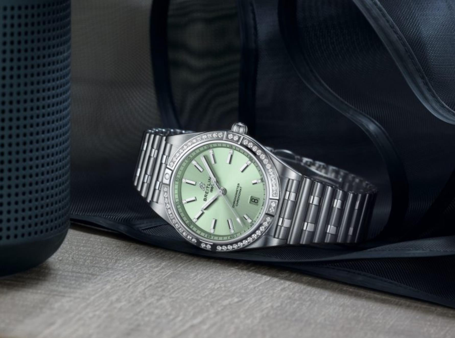 The mint green dial fake watch is decorated with diamonds.